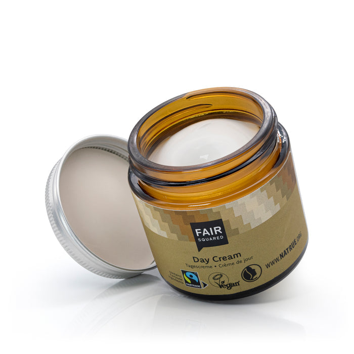 Open glass jar of Fair Squared day cream with screw top lid