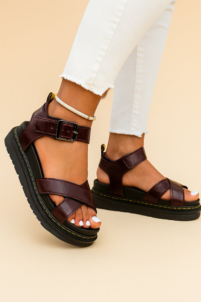 Close-up of platform sole and buckle strap on sporty sandals