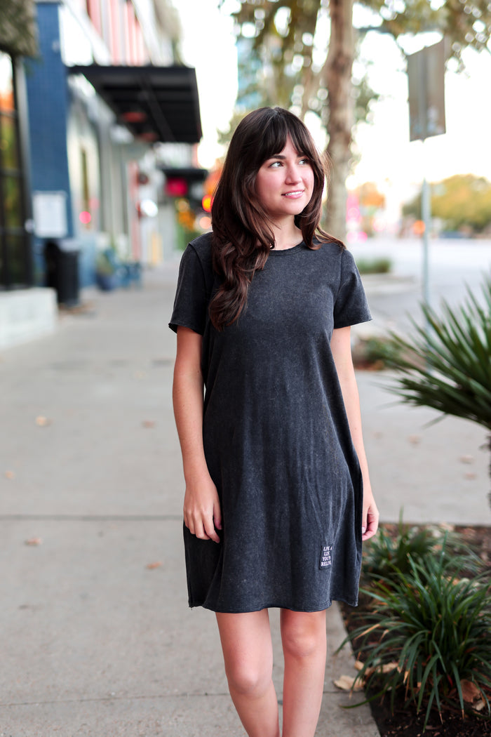 Casual short-sleeve black dress made of soft cotton, featuring a relaxed fit and cute graphic detail.
