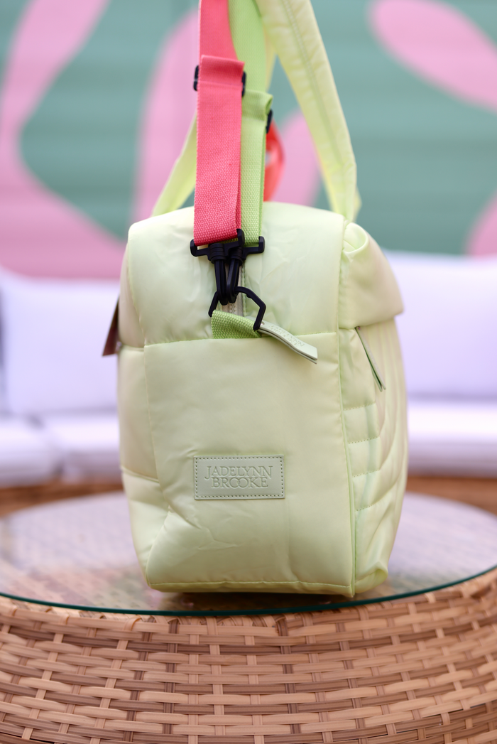 Jadelynn Brooke light green quilted bag with colorful shoulder straps, perfect for stylish outings.