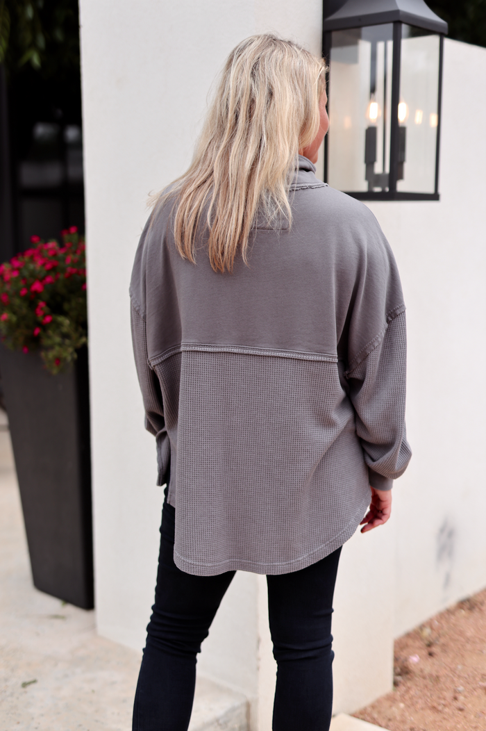 Women's cozy gray oversized long sleeve shirt in soft waffle knit, perfect for casual wear.
