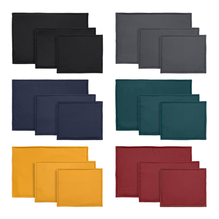 Eco-friendly dog crate liner made from water resistant cotton and sheep's wool. Four colours Black, grey, blue, green, yellow and red arranged on a white background