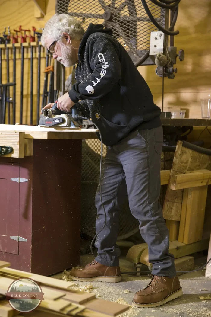 Carhartt 102821 5-Pocket Rugged Flex Slim Fit Tapered Leg Canvas Work Pant, lifestyle working image