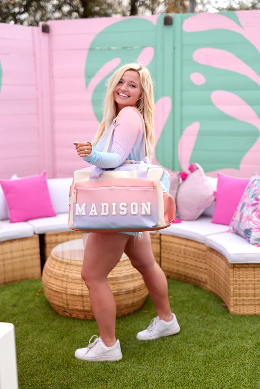 Colorful personalized duffel bag with name 'Madison', perfect for travel and gym use.