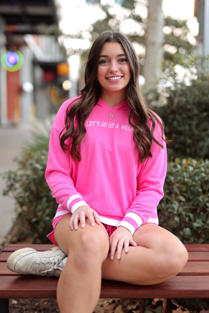 Women's pink hoodie with 'LET'S GO ON A WALK' text, stylish oversized fit, perfect for casual outings.