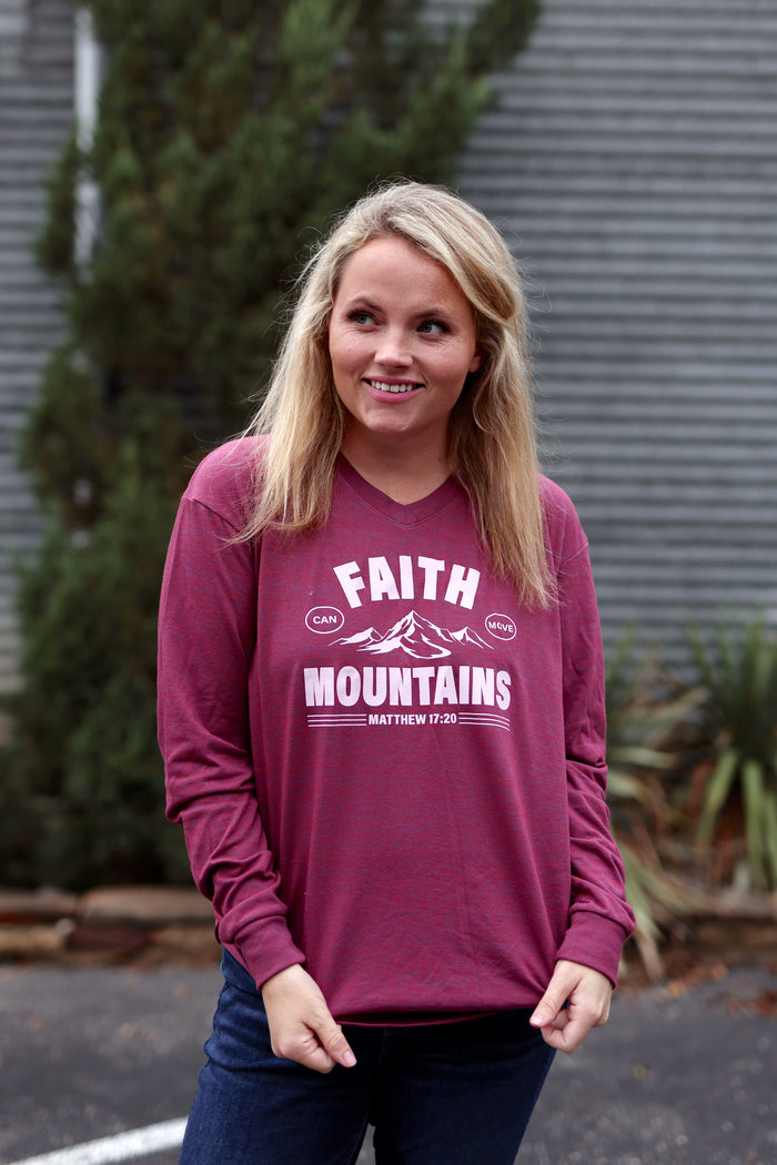 Maroon long sleeve T-shirt with 'Faith Can Move Mountains' graphic, made from soft cotton material.