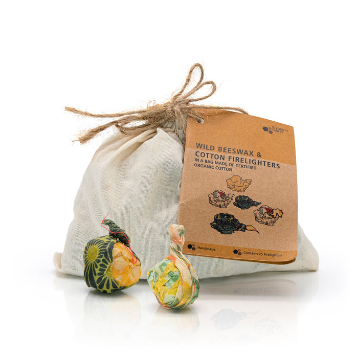 Beeswax and organic fabric firelighters outside packaging with label.