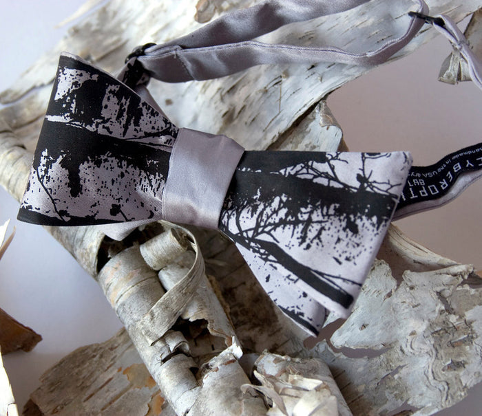 Black ink on silver bow tie.