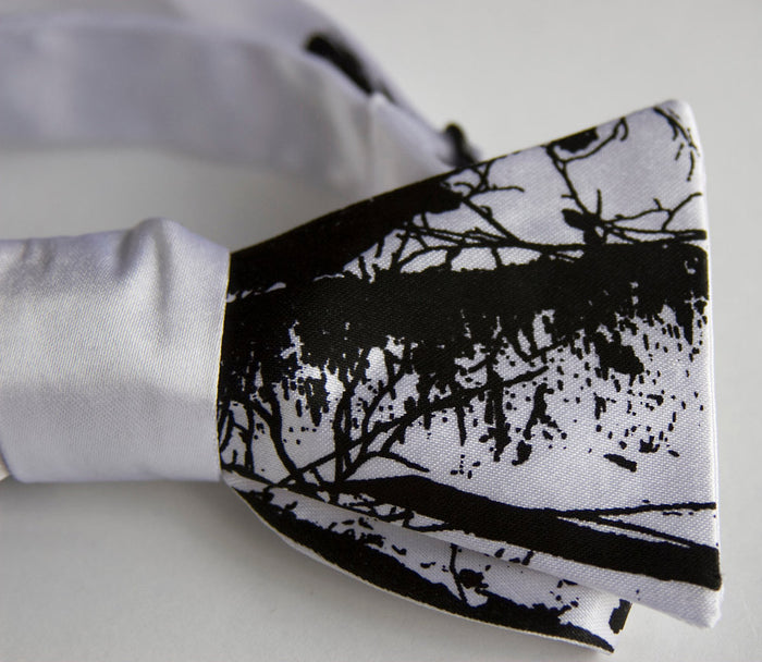Black ink on white bow tie.