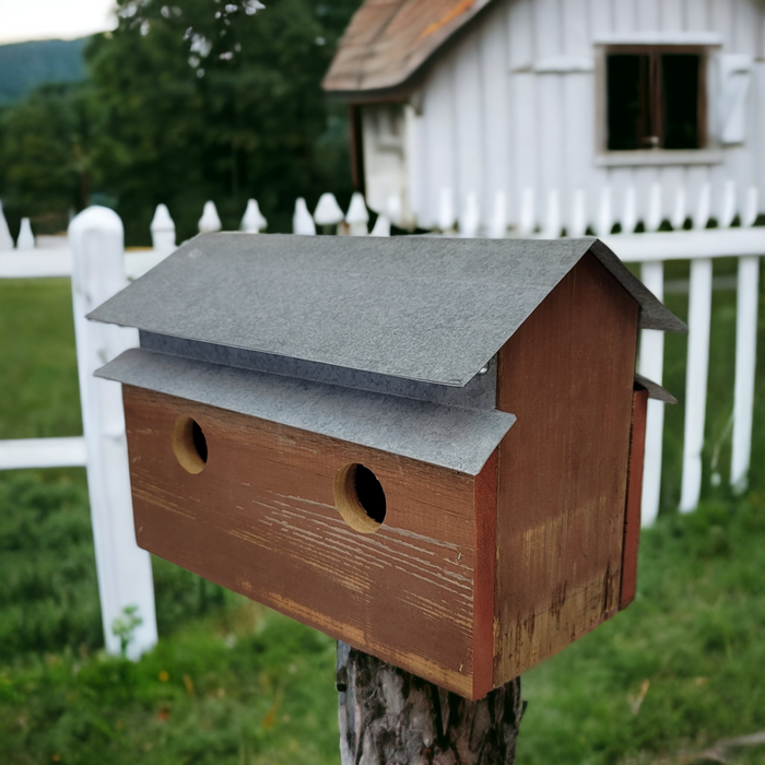 handcrafted barn shaped birdhouse