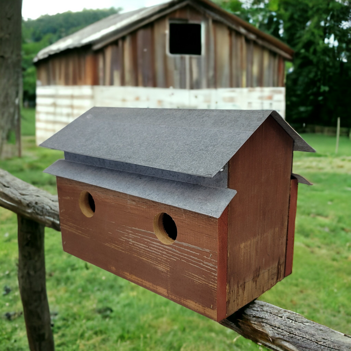 handcrafted barn shaped birdhouse