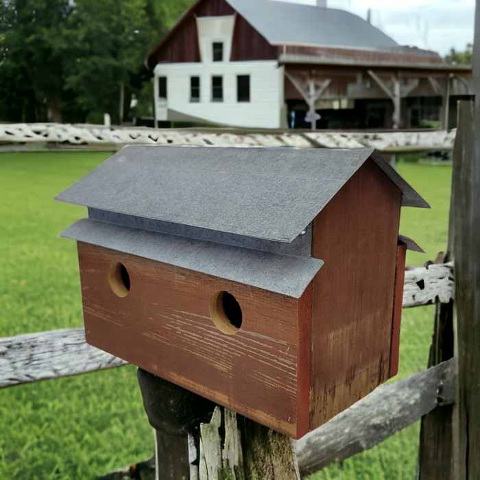 handcrafted barn shaped birdhouse