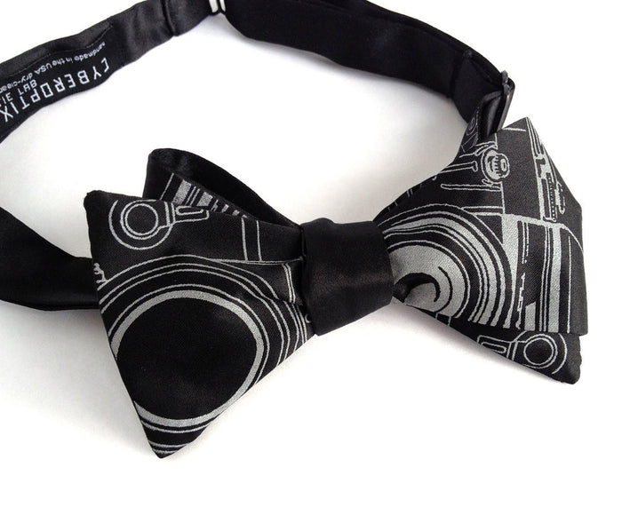 Dove gray ink on a black bow tie.