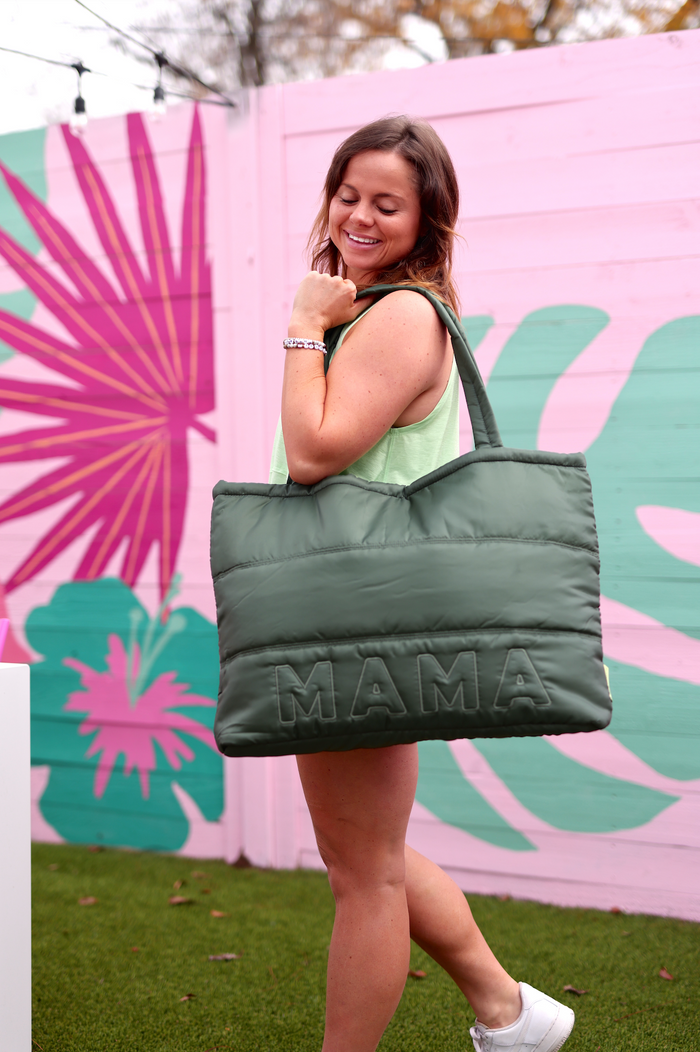 Green quilted tote bag with 'MAMA' lettering, perfect for stylish moms on the go.