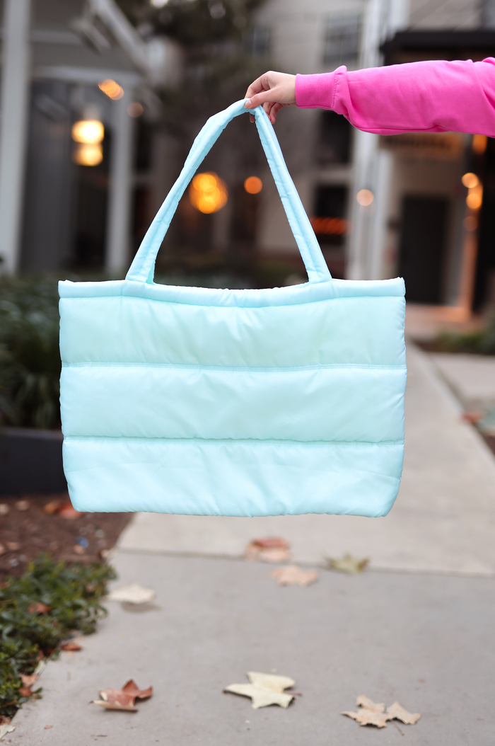 Light blue insulated tote bag with sturdy handles, perfect for shopping or outings.