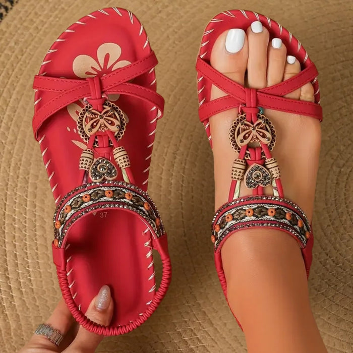 Pearl embellished flat sandals, side view showing pearl detail