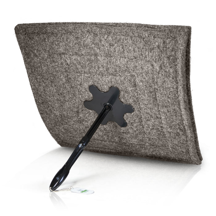 Wool chimney blocker with extension rod and handle attached.