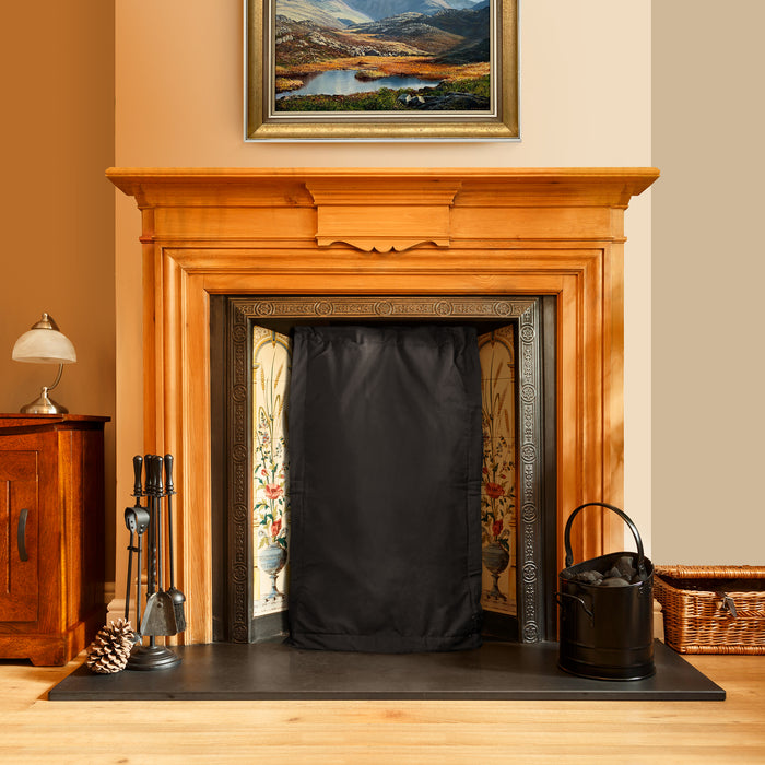 Magnetic fireplace blanket fitted to metal fire surround to block out cold chimney draughts
