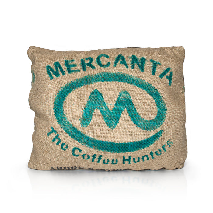 A mix off wool filled, jute hessian outdoor cushion