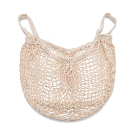 Cream coloured cotton string bag lay down on a white background.