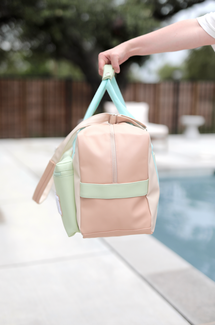 Stylish pastel backpack with mint green and peach colors, made of durable material, perfect for everyday use.