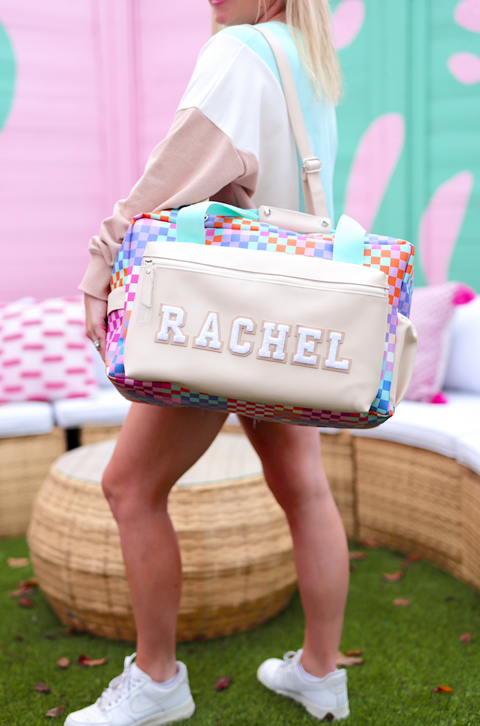 Colorful checked pattern duffel bag with personalized name, durable material, perfect for travel or gym.