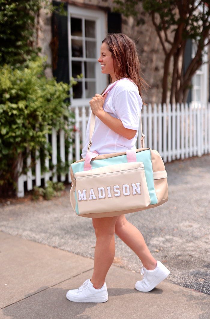Beige and mint duffel bag with personalized name 'MADISON', ideal for travel or gym.