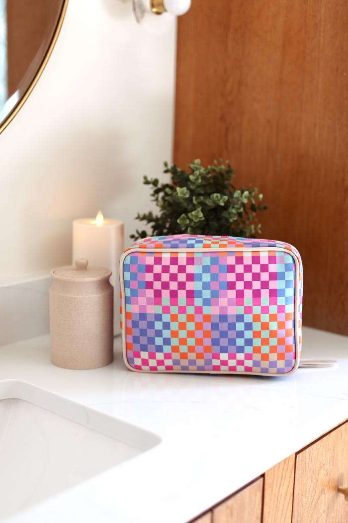 Colorful checkered cosmetic bag, waterproof material, perfect for travel and organization.