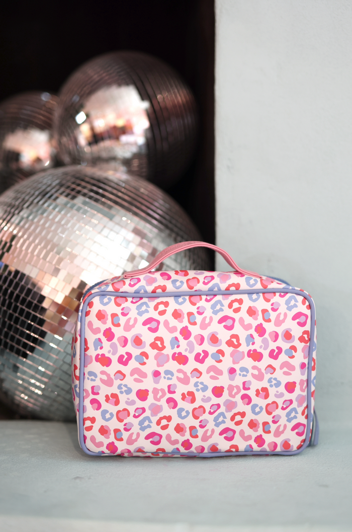 Colorful pink leopard print cosmetic bag with handle, perfect for travel and organization.