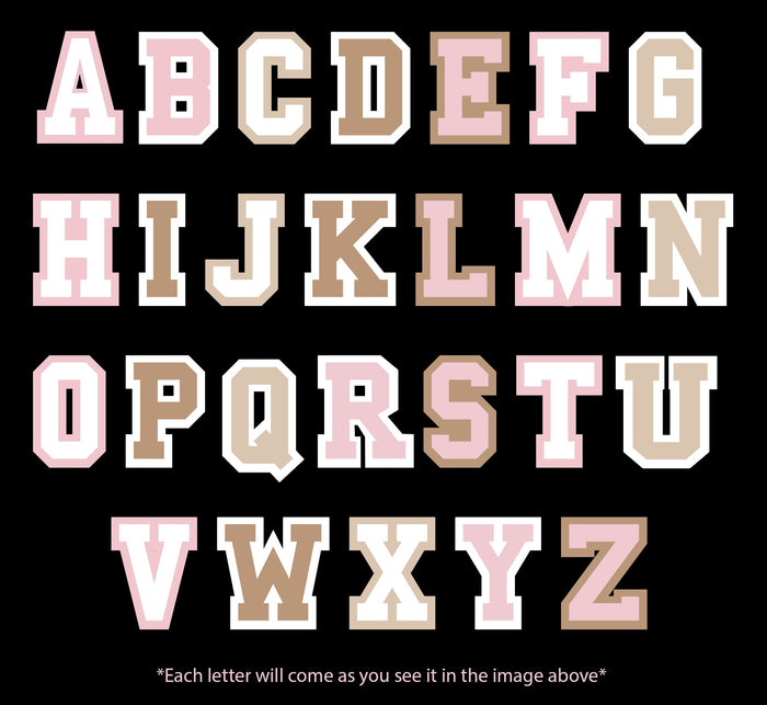 Styled alphabet letters in pink and brown, perfect for children's decor or educational materials.