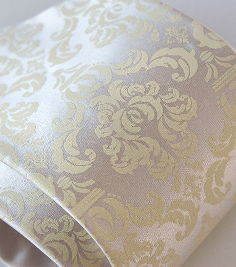 Ivory-cream ink on platinum microfiber.