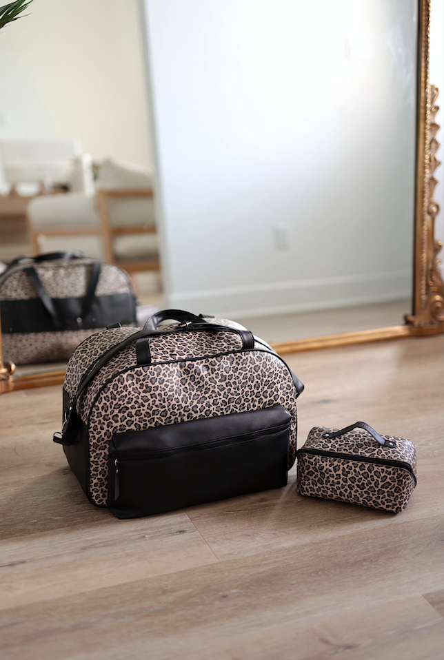 Stylish leopard print duffel bag with matching cosmetic pouch, made of durable materials, ideal for travel.