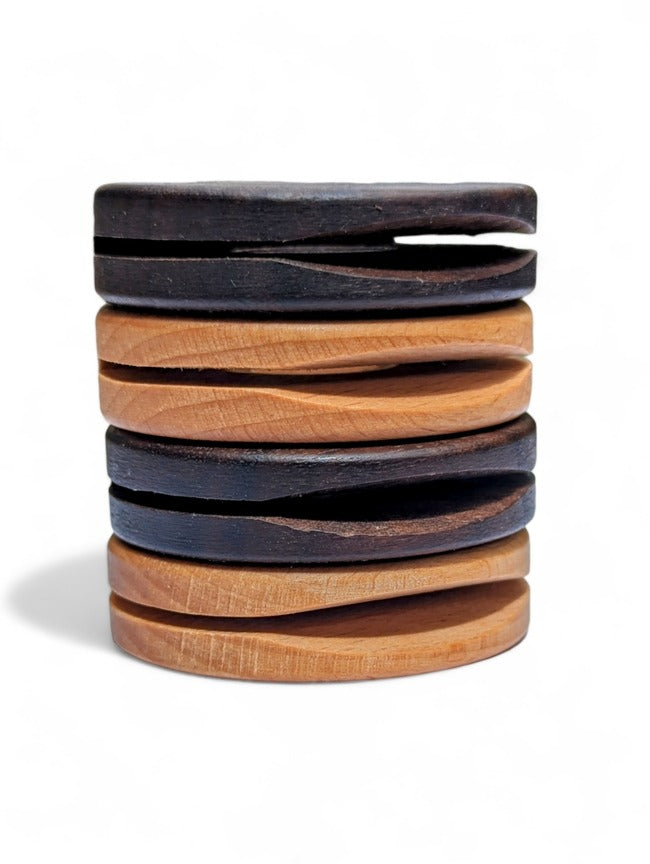 Pile of four beechwood and walnut food bag clips.