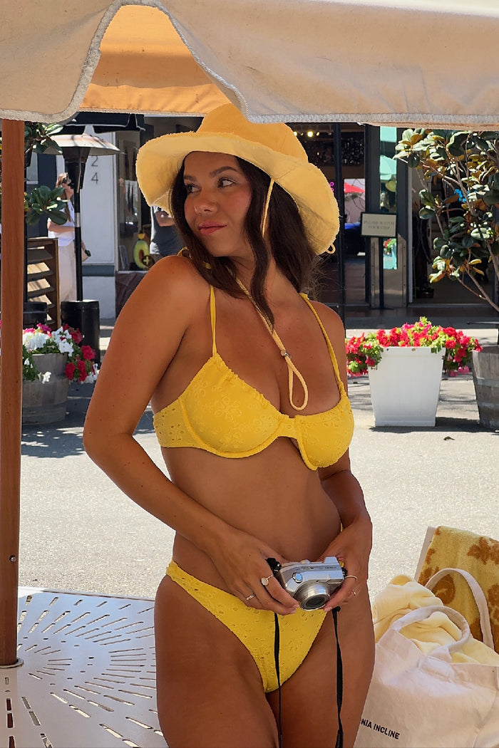 Elara high-leg bikini bottom in yellow eyelet