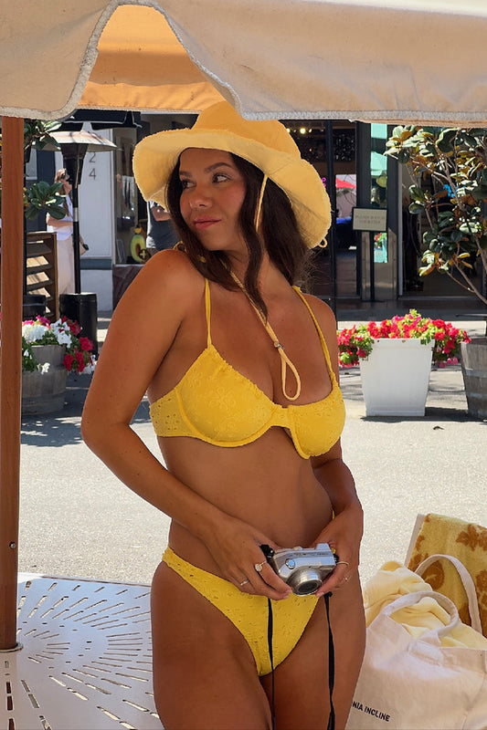 Elara high-leg bikini bottom in yellow eyelet