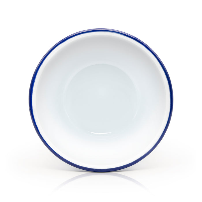 Top view of white and blue enamel pudding basin.