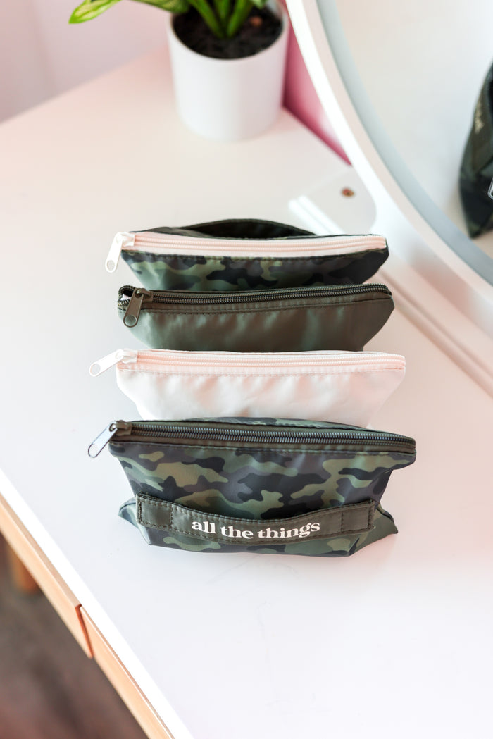 Camo, cream, and green zipper oragnizer with 4 pouches.