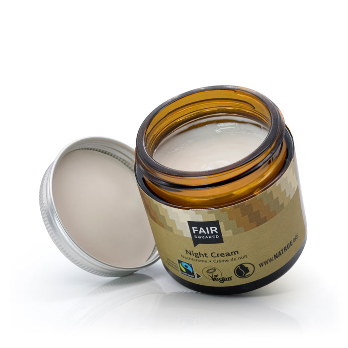 Open jar of Fair Squared night cream with visible branding on a white background