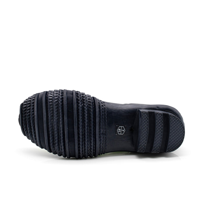Black rubber sole of ethically made gardening boot.