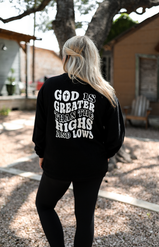 Black long sleeve shirt with 'God is greater than the highs and lows' graphic on the back.