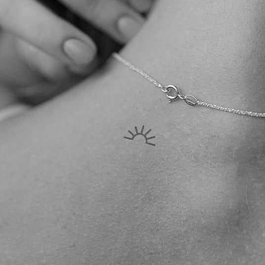 Halbsonne Tattoo