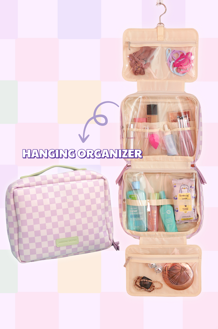 Pink plaid hanging makeup organizer with compartments for skincare and accessories.