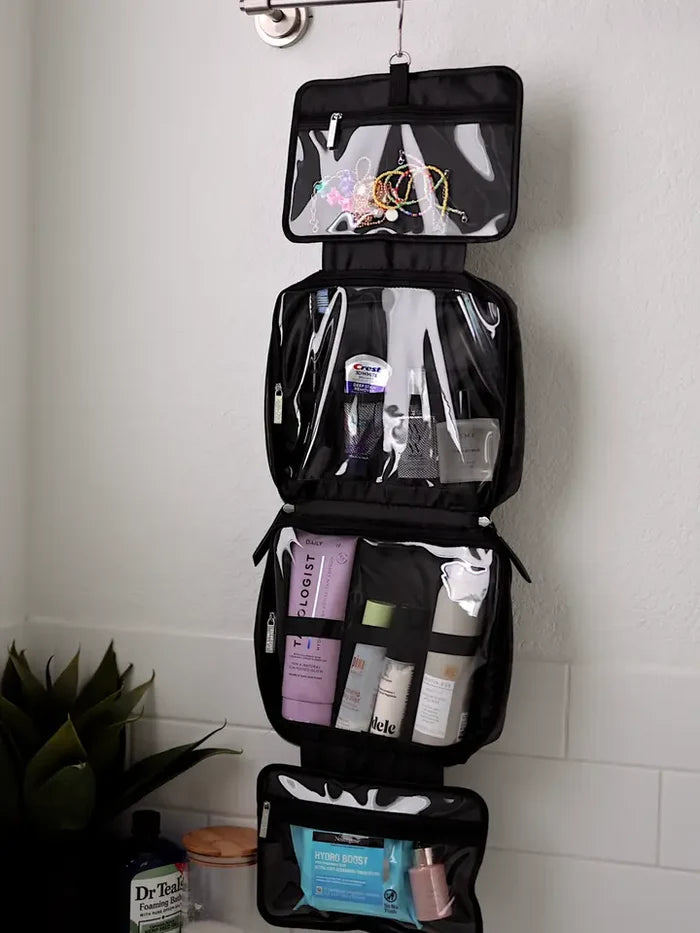 Black hanging toiletry bag with clear pockets, ideal for skincare and makeup organization.