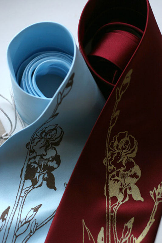 Bronze on sky blue, gold on burgundy.