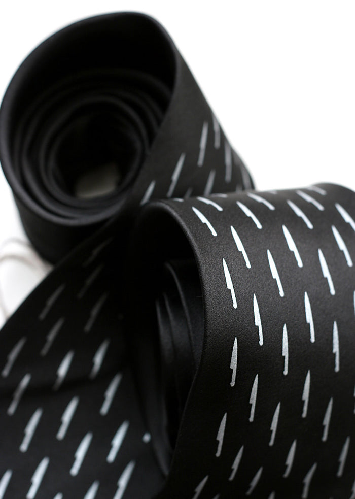 Sharp Dressed Necktie. Silver on black.