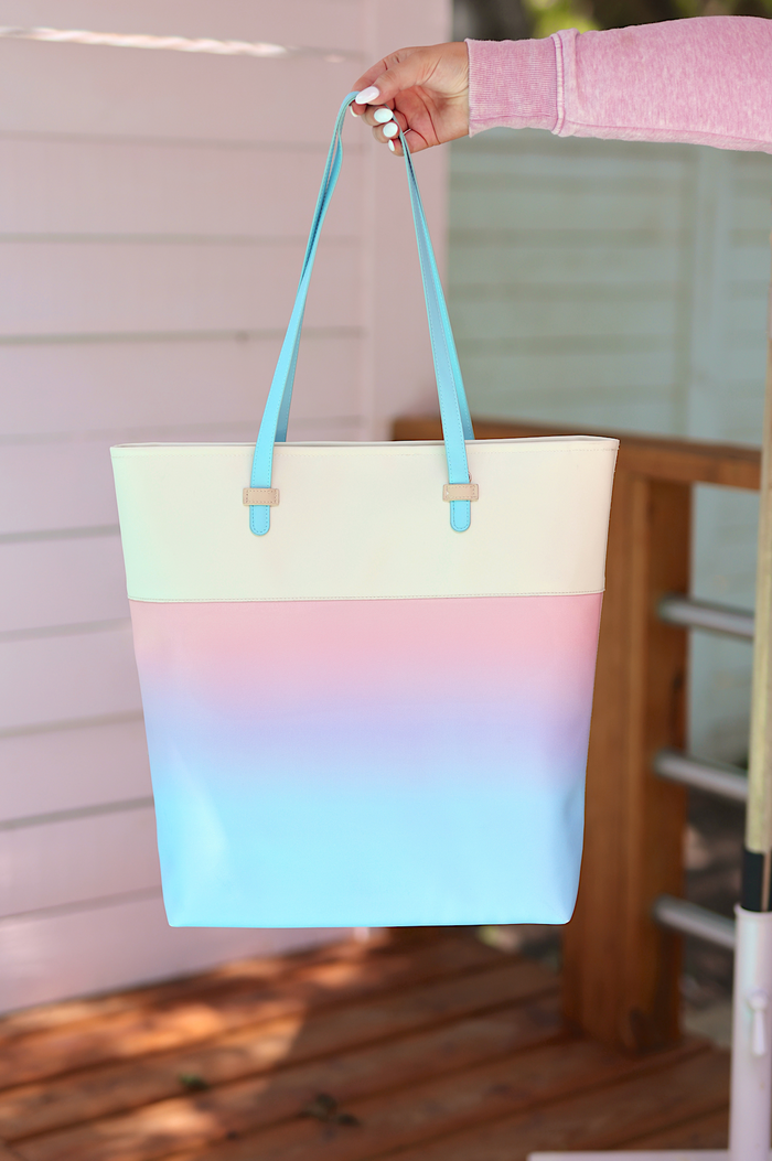 Pastel gradient tote bag with blue handles, made of durable material, perfect for everyday use.