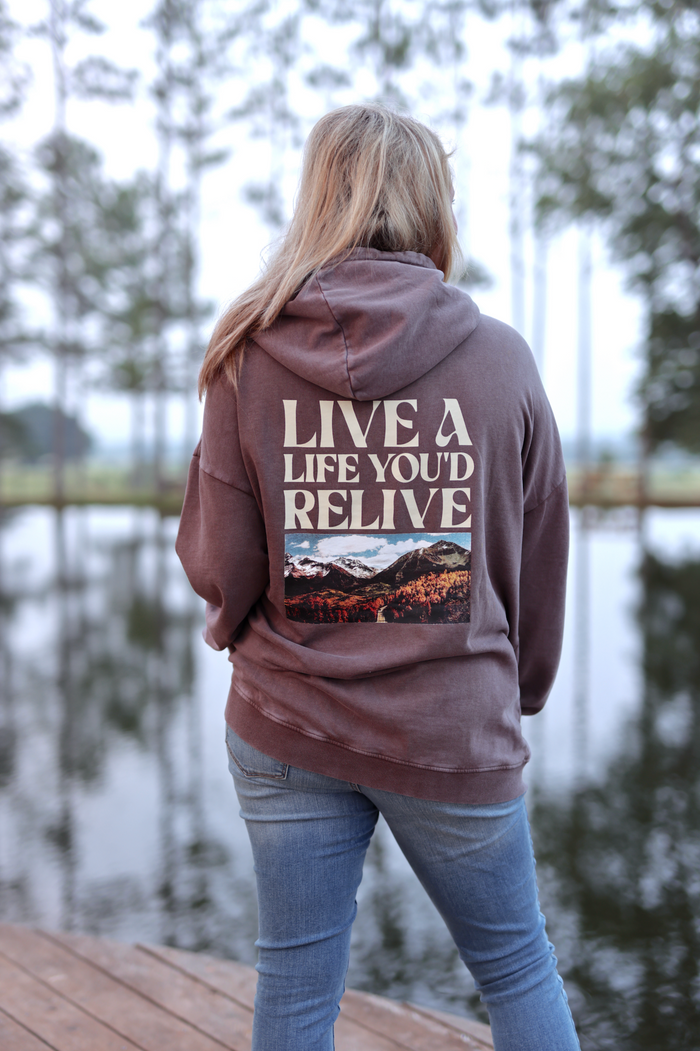 Brown hoodie featuring 'LIVE A LIFE YOU'D RELIVE' graphic on back, perfect for casual wear.