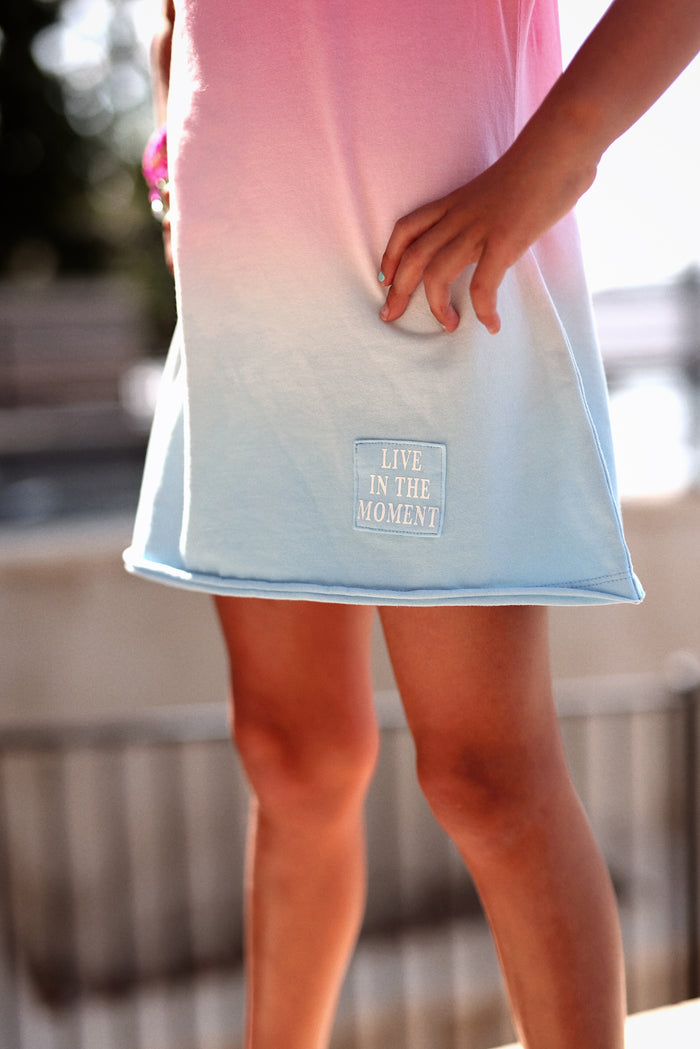 Girls' ombre dress in pink to blue, featuring 'Live in the Moment' embroidery, perfect for casual summer wear.