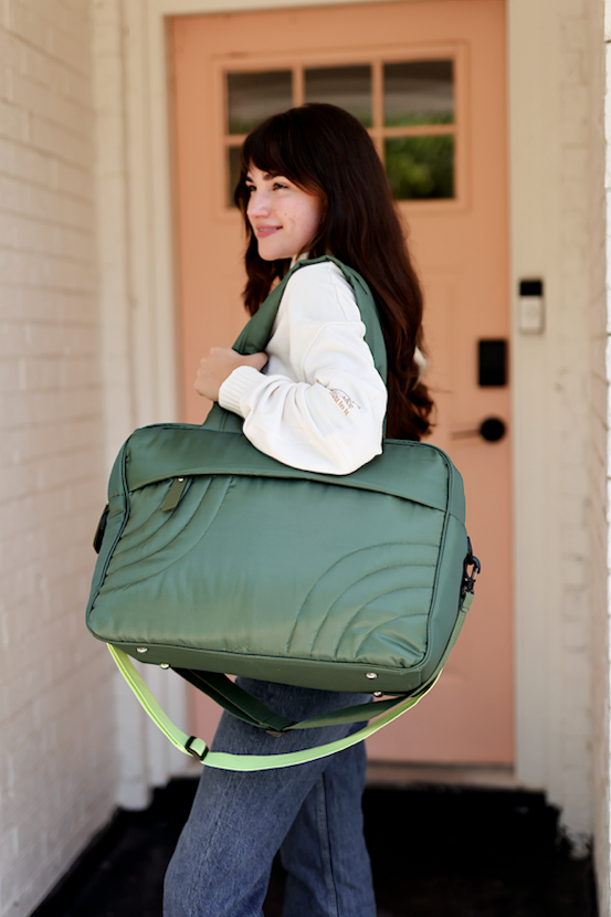 Stylish green quilted tote bag with adjustable strap, perfect for daily use and travel.
