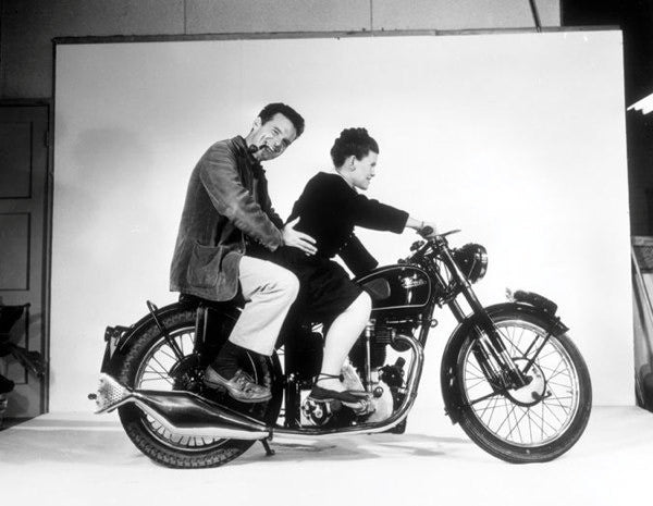 Charles and Ray Eames pose on a Velocette motorcycle, 1948. ©Eames Office, LLC